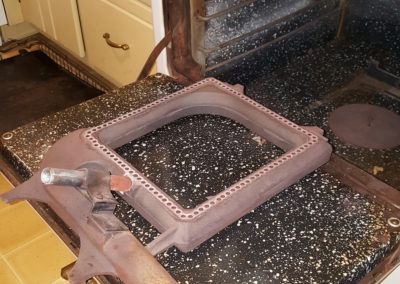 Old stove component on countertop