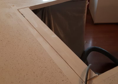 Countertop with tape and appliances visible