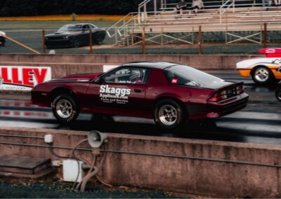 Car racing on a drag strip.